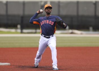 Feb 18, 2024; West Palm Beach, FL, USA; Houston Astros relief pitcher Oliver Ortega (63) plays catch at spring training. Mandatory Credit: Sam Navarro-USA TODAY Sports