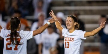 Texas Longhorns forward Holly Ward (13) celebrates her fourth goal of the game with midfielder Ashlyn Miller (27) in the second half of the Longhorns' first-round NCAA Division I Women's Soccer Championship match against Boston University at Mike Myers Stadium in Austin, Nov. 15, 2024.