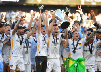 Dec 7, 2024; Carson, California, USA; LA Galaxy defender Maya Yoshida (4) celebrates with teammates and the Philip F. Anschutz trophy after defeating the New York Red Bulls in the 2024 MLS Cup at Dignity Health Sports Park. Mandatory Credit: Gary A. Vasquez-Imagn Images
