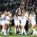Dec 9, 2024; Cary, NC, USA; North Carolina players celebrate with the trophy after the win at WakeMed Soccer Park. Mandatory Credit: Bob Donnan-Imagn Images